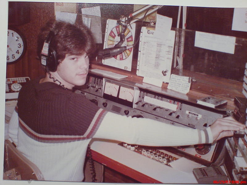 Young Brad Johnson working at a radio studio console